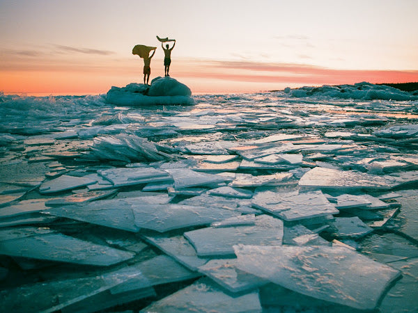 Jesper’s film photo of two people on the ice at sunset